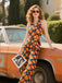 Orange 1970er Halter Geometrischer Druck Jumpsuit