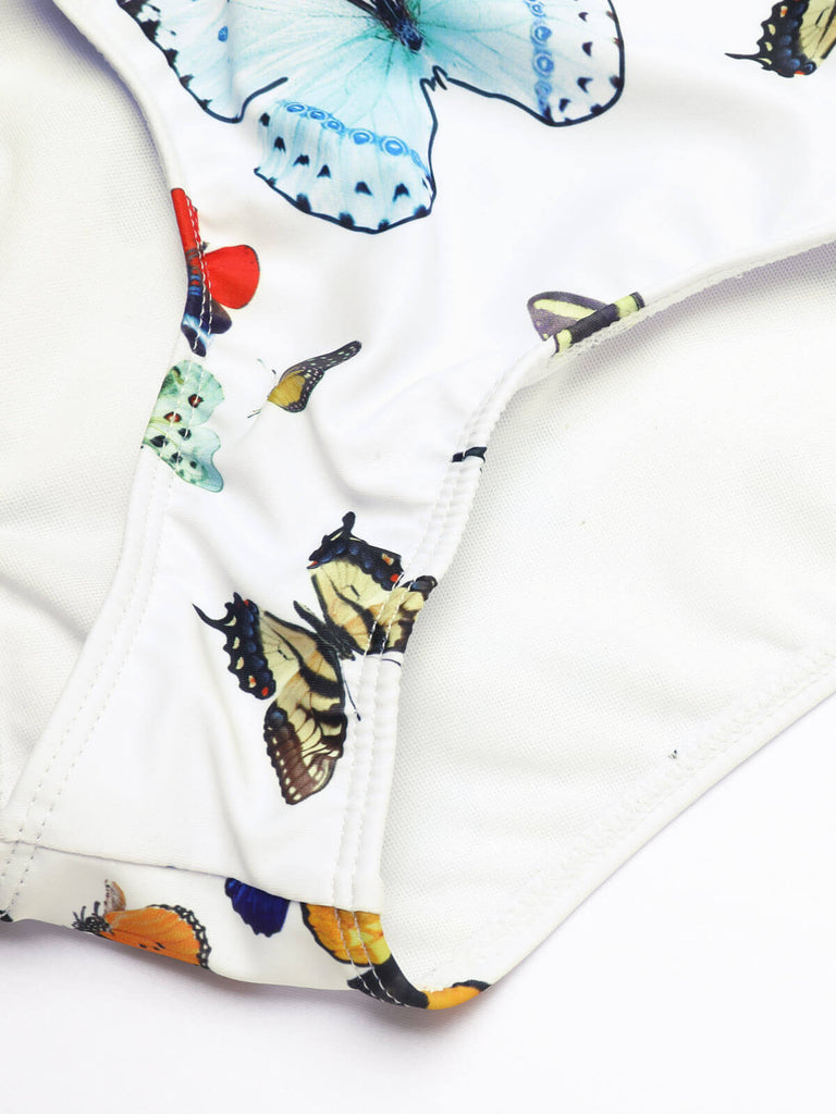 EINTEILIGER BADEANZUG MIT BUTTERFLYS-RIEMEN & ÜBERDECKEROCK